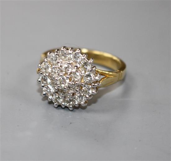 A modern 18ct gold and diamond cluster dress ring,
